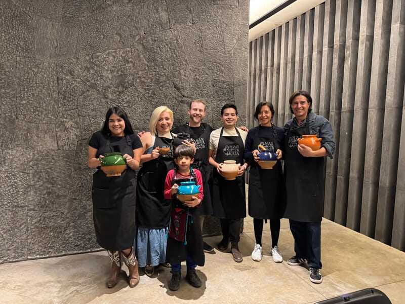 Bean to Beverage: Roast and grind cacao into chocolate - Grinding chocolate on a traditional metate