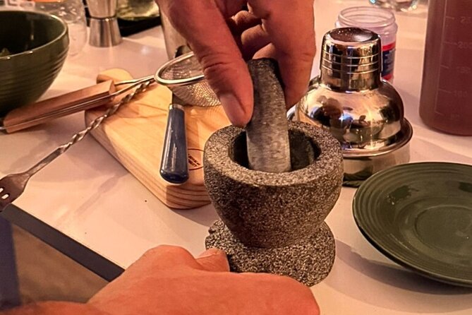 Mexican Mixology Workshop with Panoramic View in Coyoacán - Grinding a custom salt in a molcajete